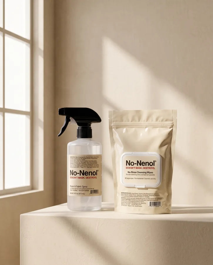 No-Nenol Room & Fabric Spray and No-Rinse Cleansing Wipes on a cream plinth in window light